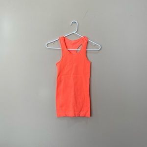 Tight fitting neon orange workout tank top